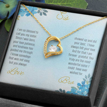 Forever Love Necklace with a yellow gold variant on a to sis from bro greeting card close up view in a two-tone box angled slightly to the right.