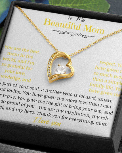 A yellow gold forever love necklace up close angled to the right