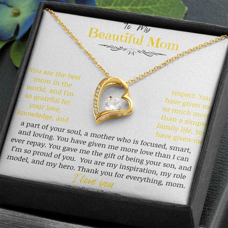 A yellow gold forever love necklace up close angled to the right