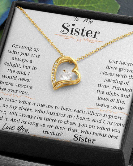 a yellow gold forever love necklace angled right on table