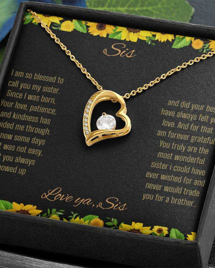 Forever Love Necklace with a yellow gold charm on a To Sis from Sis greeting card up close angled slightly to right in a two-tone box