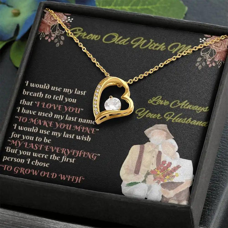 yellow gold forever love necklace in two-tone box angled right