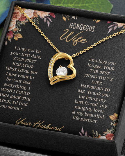 A yellow gold Forever Love Necklace on a to wife greeting card in a two-tone box up close.