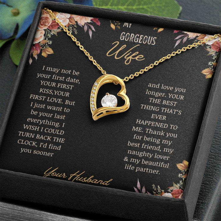 A yellow gold Forever Love Necklace on a to wife greeting card in a two-tone box up close.