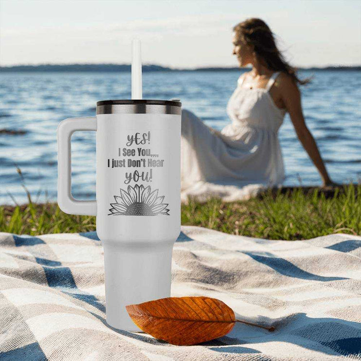 white pinnacle 40oz tumbler on beach