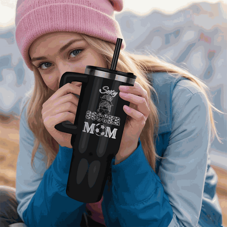 black tumbler 40oz pinnacle in model's hands