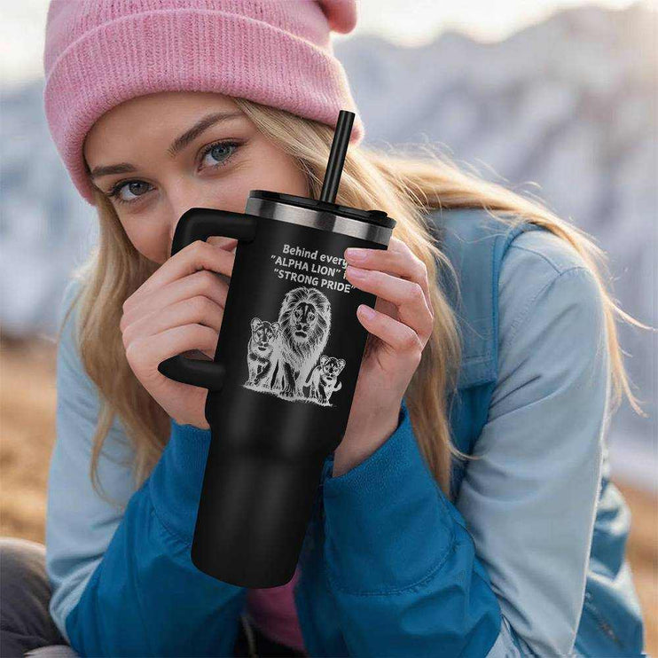 black tumbler 40oz pinnacle in model's hand