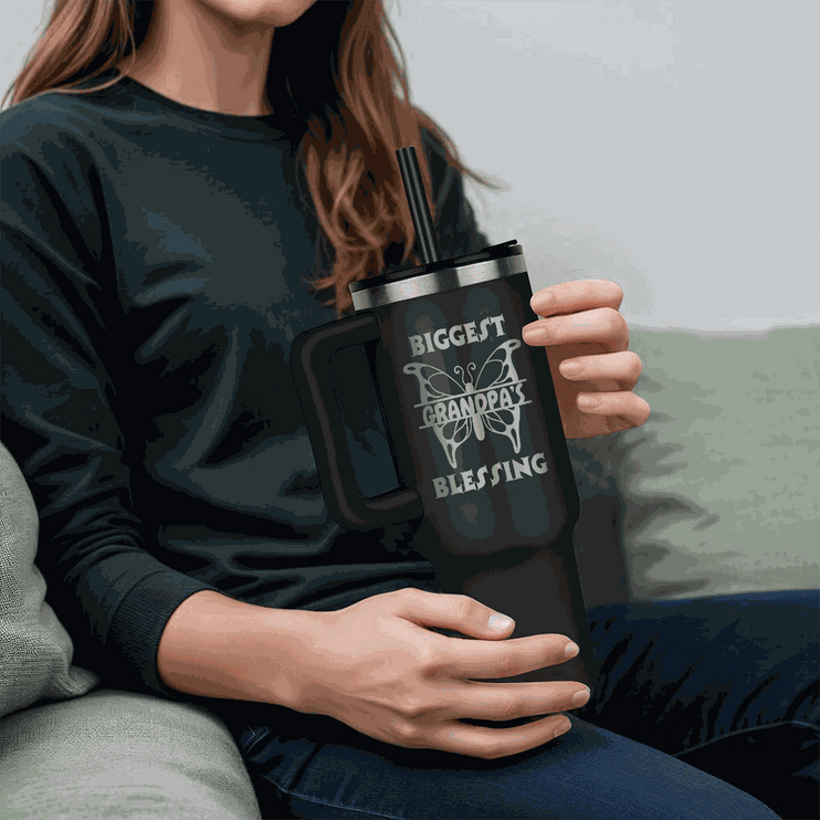 black tumbler 40oz pinnacle with a model holding it