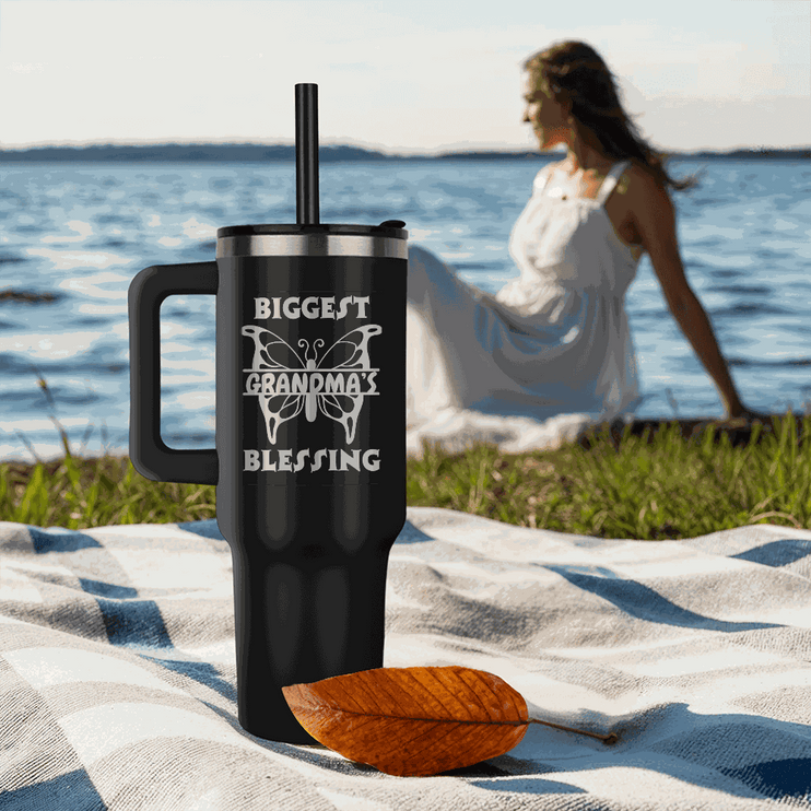 black tumbler 40oz pinnacle on the beach sand