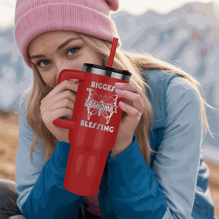 red tumbler 40oz pinnacle in a model's hands