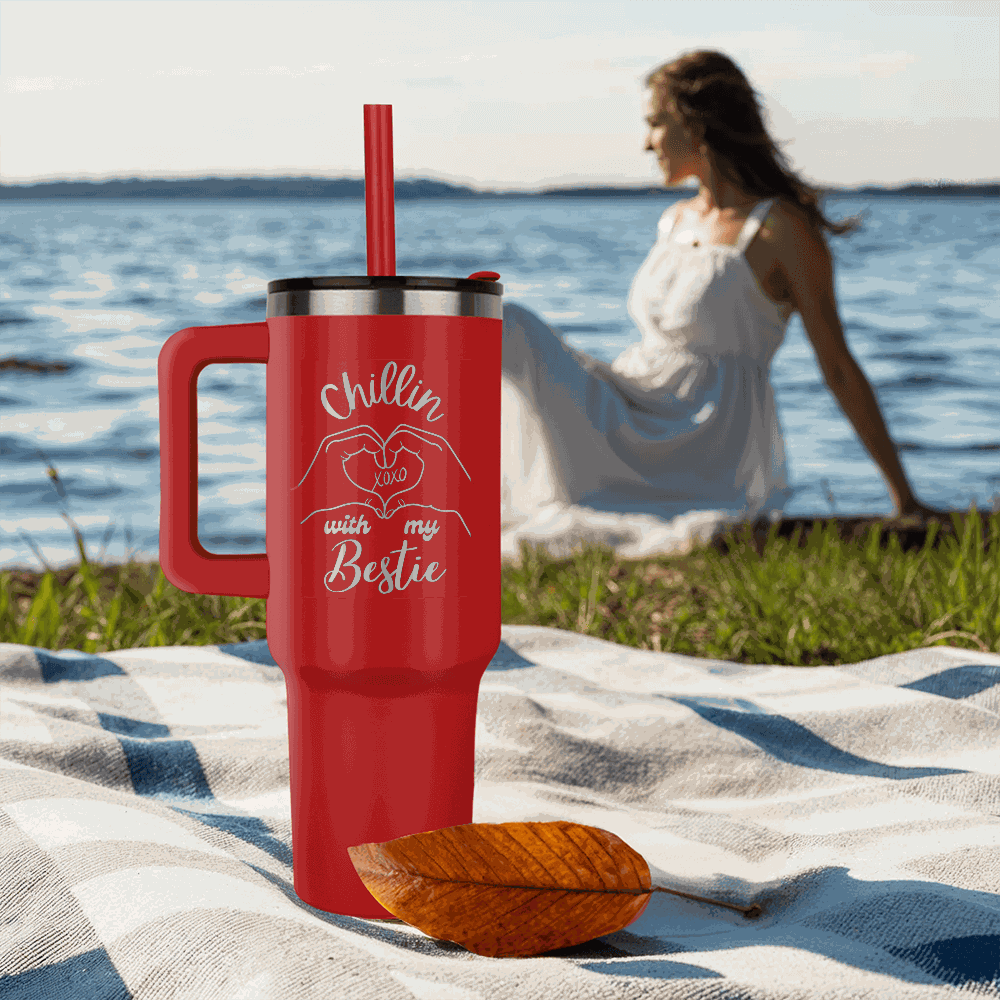 red tumbler 40oz pinnacle on a sandy beach