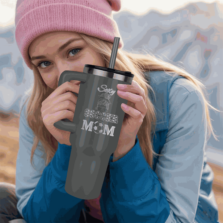 grey tumbler 40oz pinnacle in model's hands