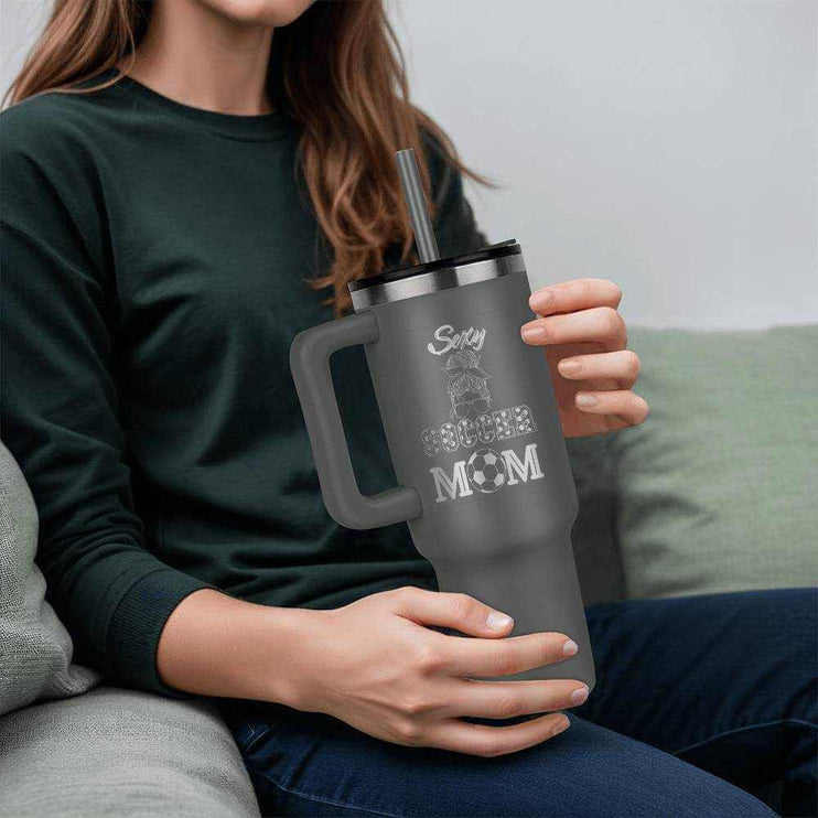 grey tumbler 40oz pinnacle in model's hands