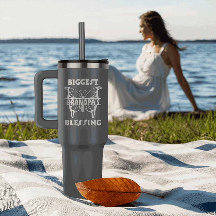 grey tumbler 40oz pinnacle on a beach