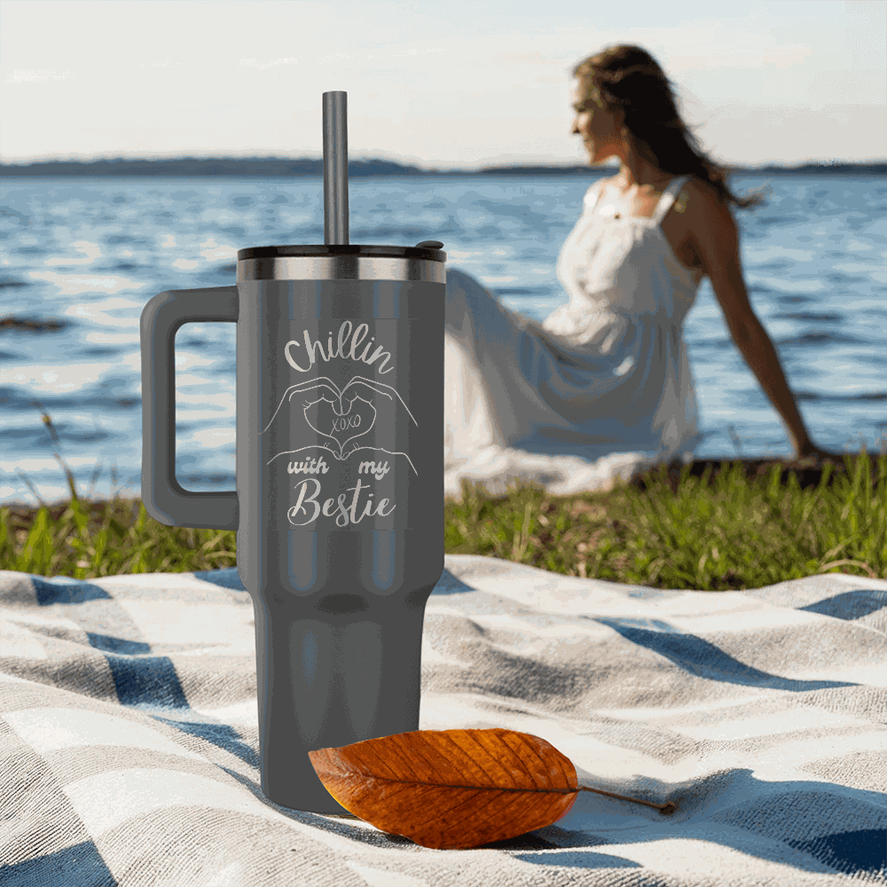 grey tumbler 40oz pinnacle on a sandy beach