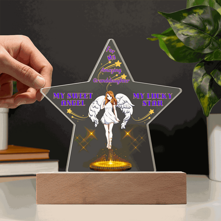 12v acrylic star plaque on an office desk with dark background