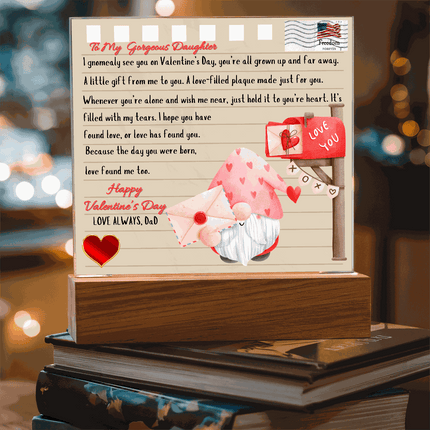 12v acrylic square plaque on a stack of books