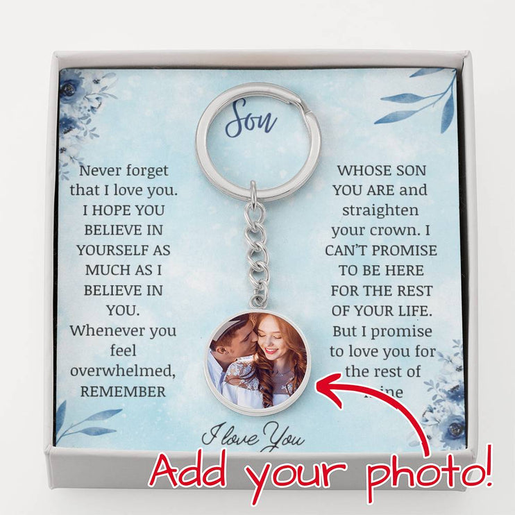 a Photo Upload Personalized Circle Pendant Keychain in polished stainless steel in a two-tone box