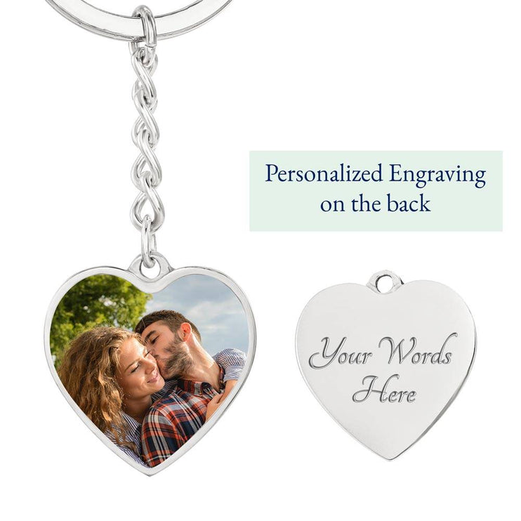 A polished stainless-steel photo upload personalized heart pendant keychain showing the engraving feature.