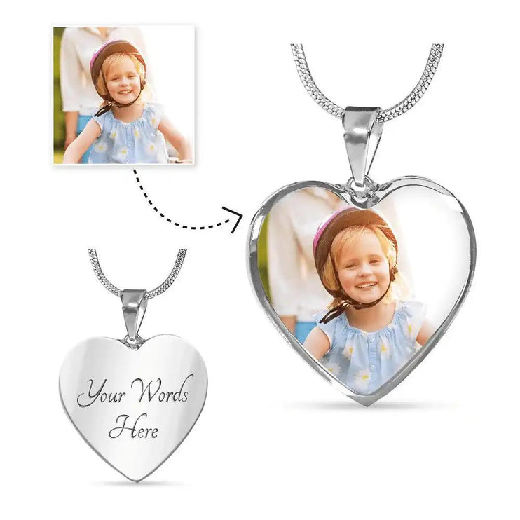 a polished stainless-steel photo upload personalized heart necklace up close showing picture