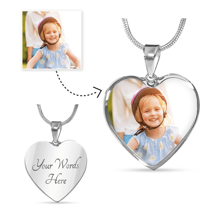 a polished stainless steel photo upload personalized heart pendant necklace showing engraving.