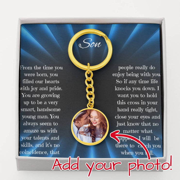 Photo Upload Personalized Circle Pendant Keychain with a yellow gold finish inside a two-tone box